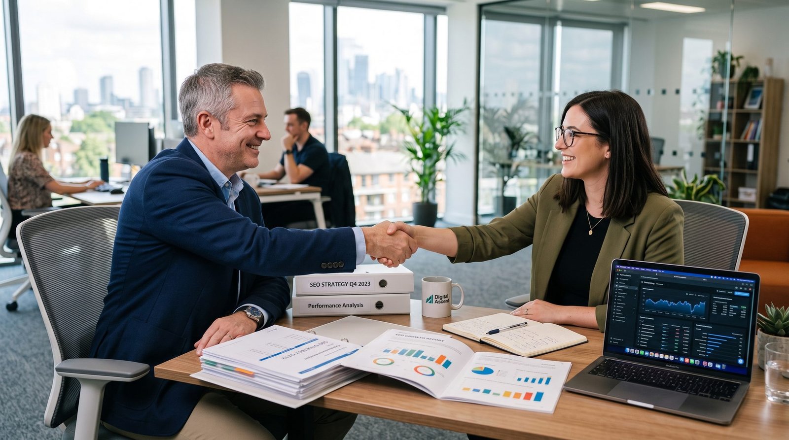 Business owner shaking hands with an SEO consultant in a meeting